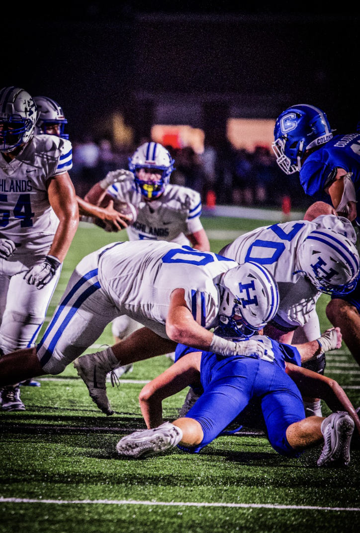 Max Merz (11) pancakes his opponent. Merz said, "It's just what I do, all day everyday. You can't get passed me."